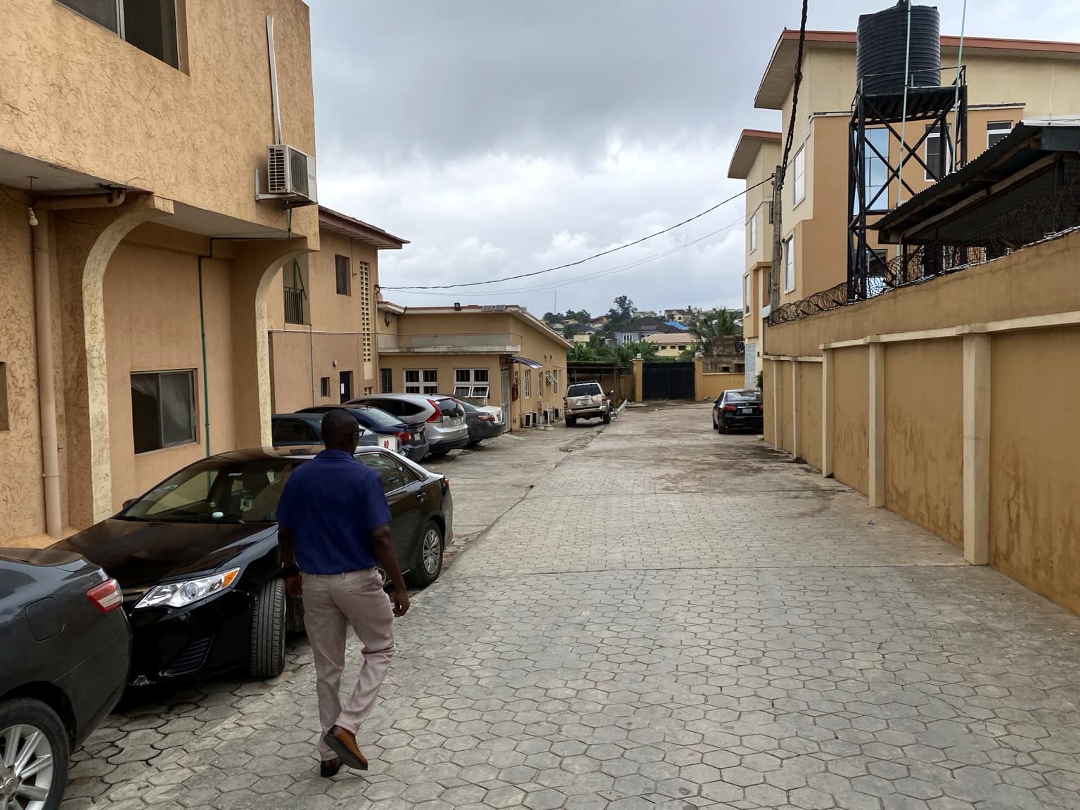 A member of staff walking through the compound at Banby Specialist Hospital in Akobo, Ibadan